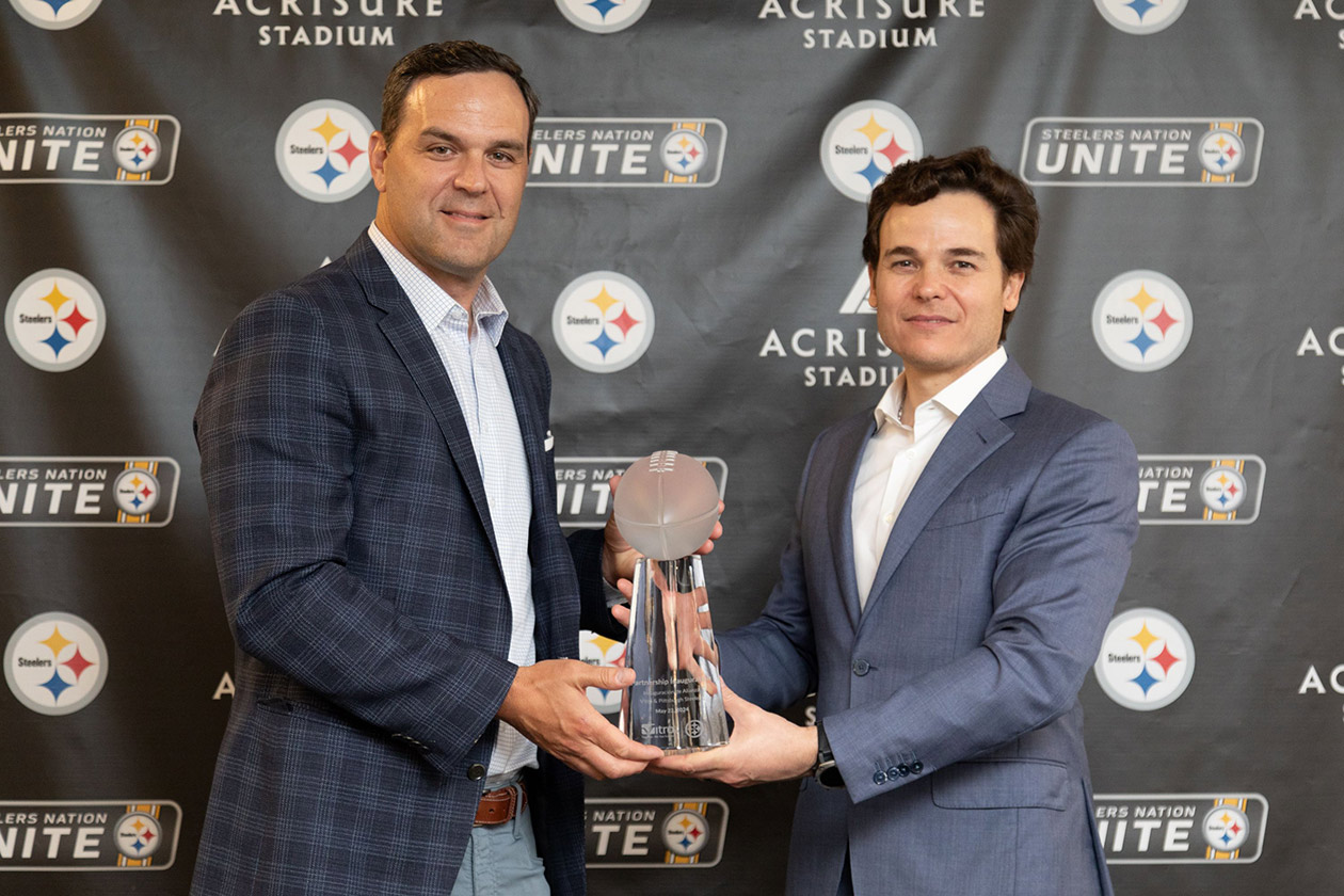 Pictured: Steelers Vice President of Sales & Marketing Ryan Huzjak (left) and Vitro CEO Adrian Sada (right) with the crystal Vince Lombardi Trophy. (Photography: Ray Cordero, Mainline Photography)